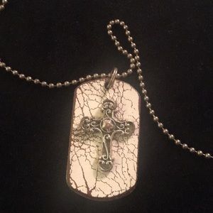 Rustic dog tag style cross necklace on cork